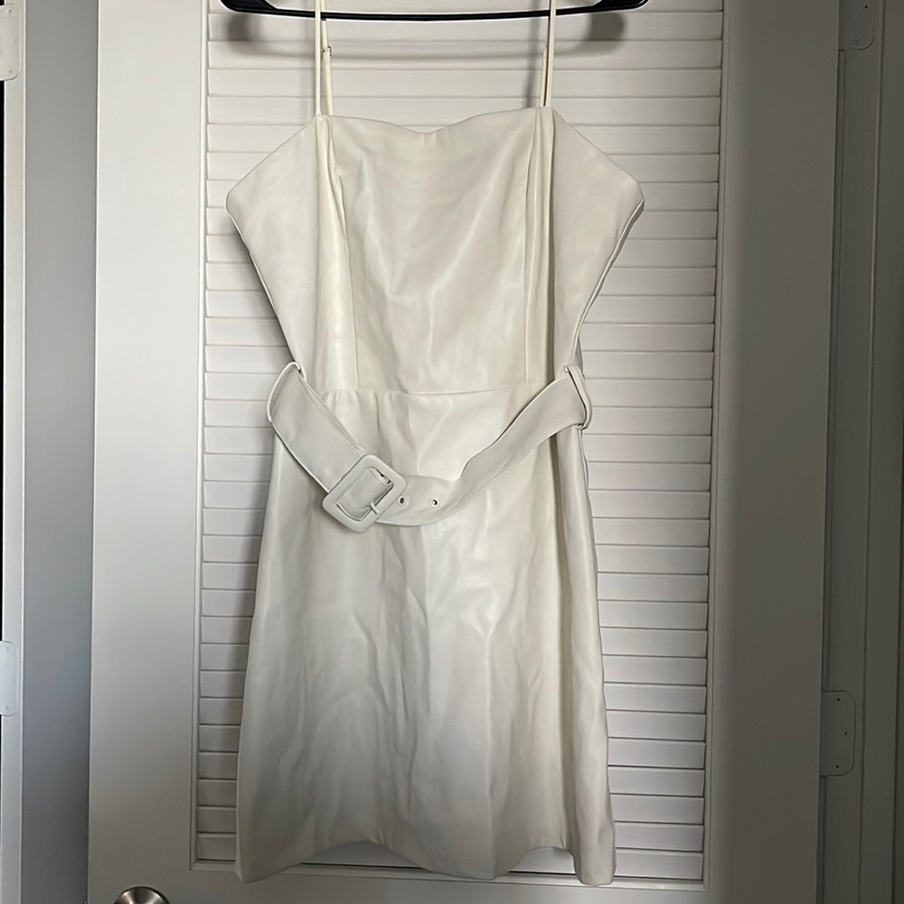 Lucy Paris white faux leather dress w/ adjustable belt at the waist.